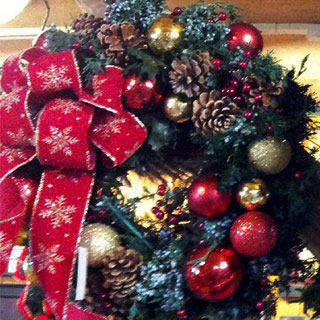 Celebrate the holidays with a decadent Christmas Wreath from Howell's Floral.